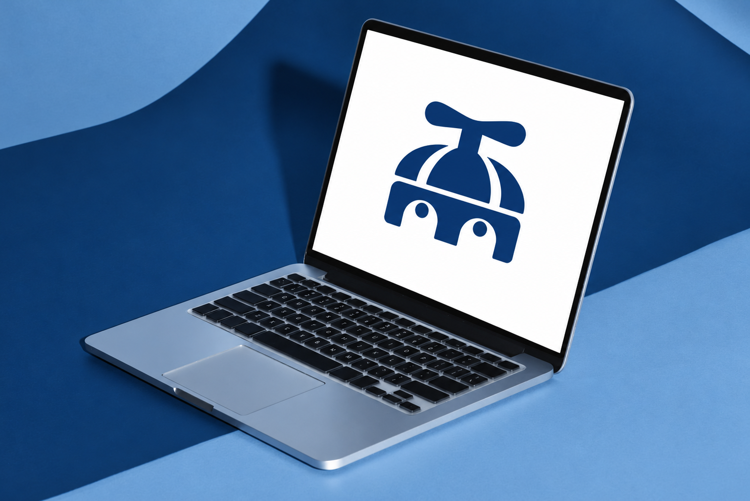 A laptop showing the TopOfMind mark, lit against a blue studio backdrop